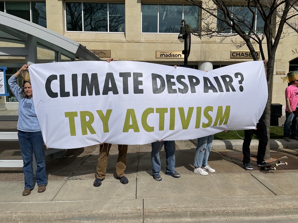 banner with words "Climate Despair? Try Activism!"